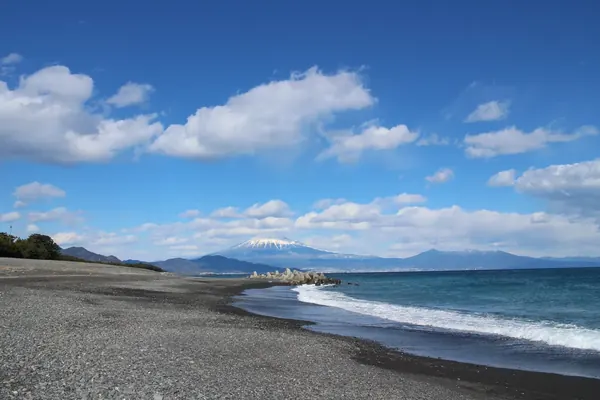 The long black-sand beach of Miho with Fuji on the horizon