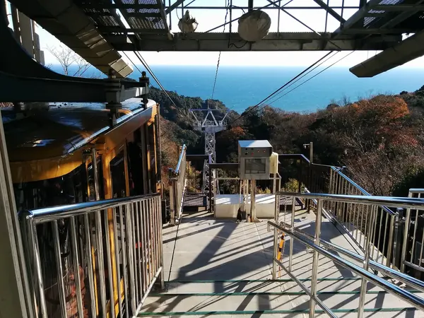 Boarding platform with Suruga Bay behind