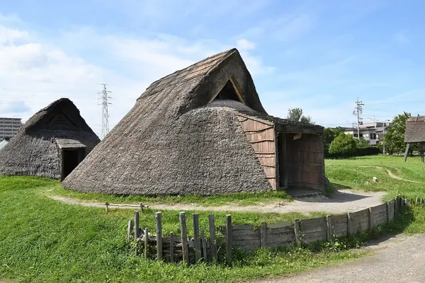 A reconstructed thatched pit dwelling